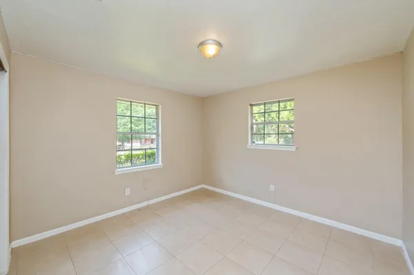 an empty room with windows