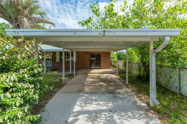 a house view with a garden space