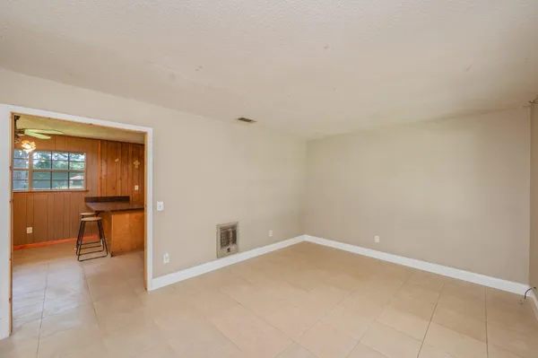 wooden floor and cabinet in an empty room