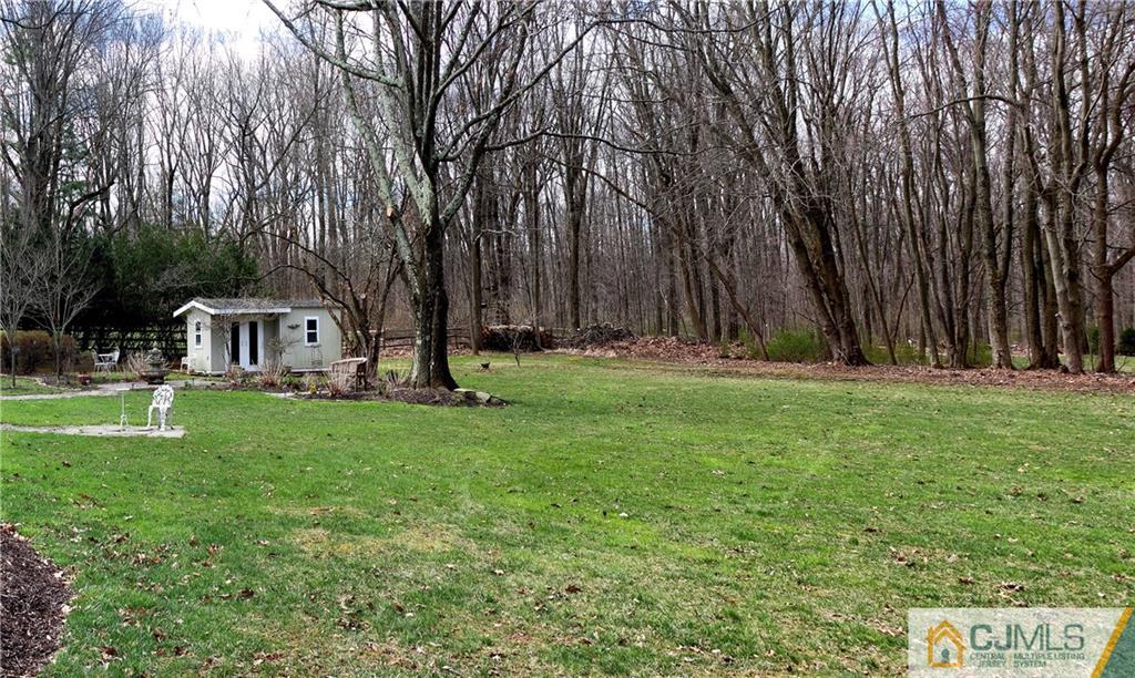 338 Springhill Road Skillman, NJ 08558 - Photo 23 of 23 a view of a house with backyard and trees