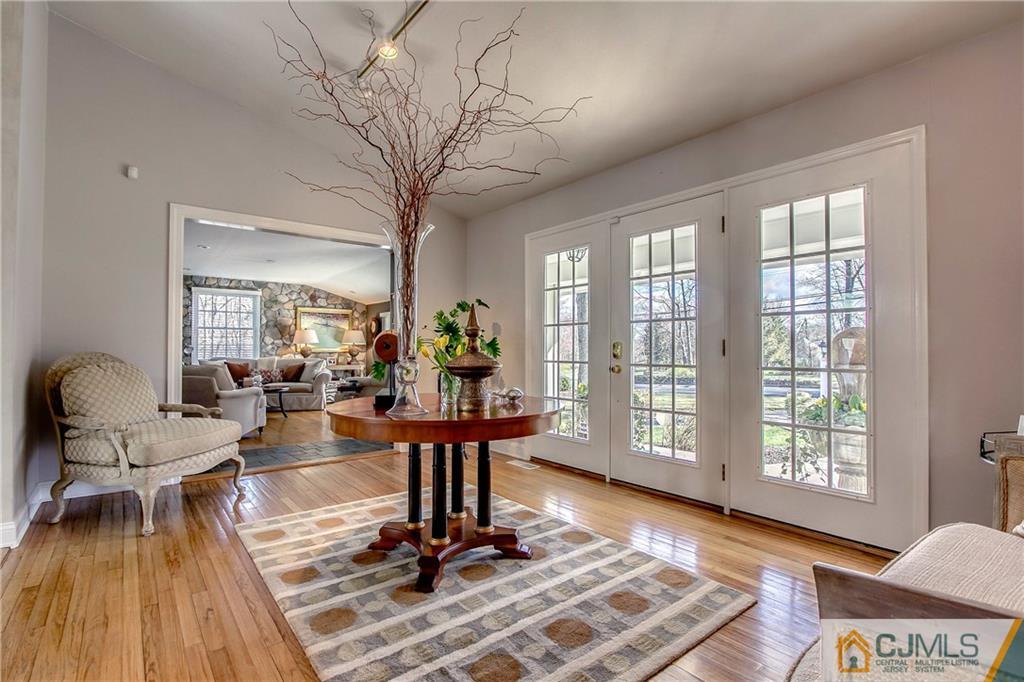 338 Springhill Road Skillman, NJ 08558 - Photo 4 of 23 a living room with furniture and a floor to ceiling window
