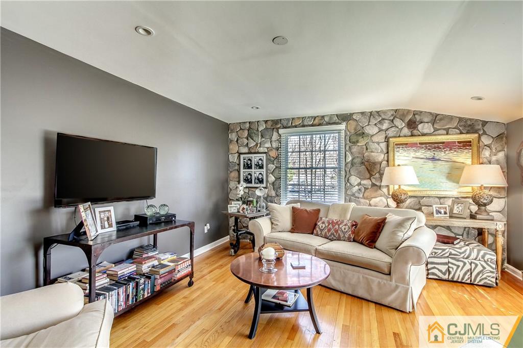 338 Springhill Road Skillman, NJ 08558 - Photo 6 of 23 a living room with furniture and a flat screen tv