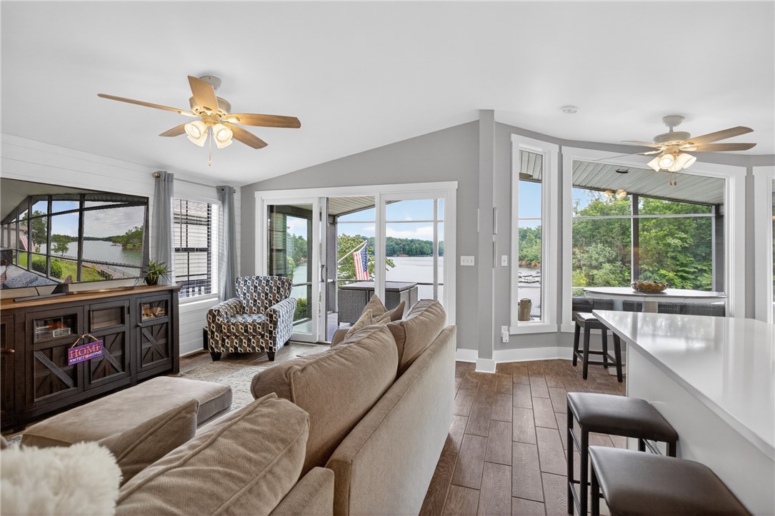 1230 Melton Road, Unit 4 West Union, SC 29696 - Photo 45 of 48 Floor-to-ceiling windows and sliding glass doors offer captivating views of the lake.