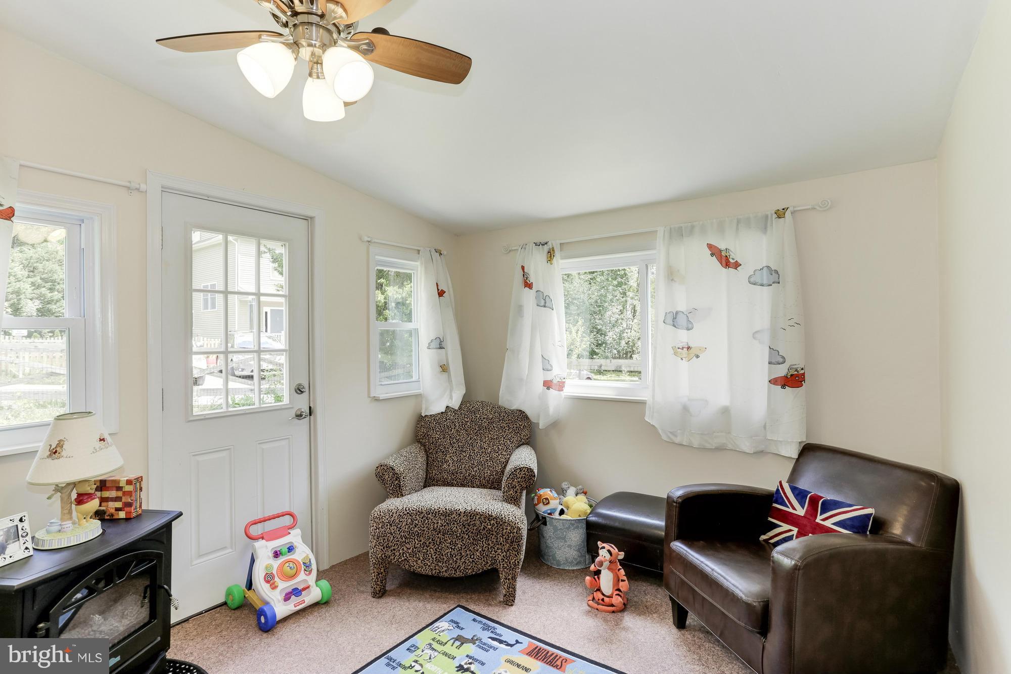 23 Ericsson Road Cabin John, MD 20818 - Photo 13 of 30 a living room with furniture and a window
