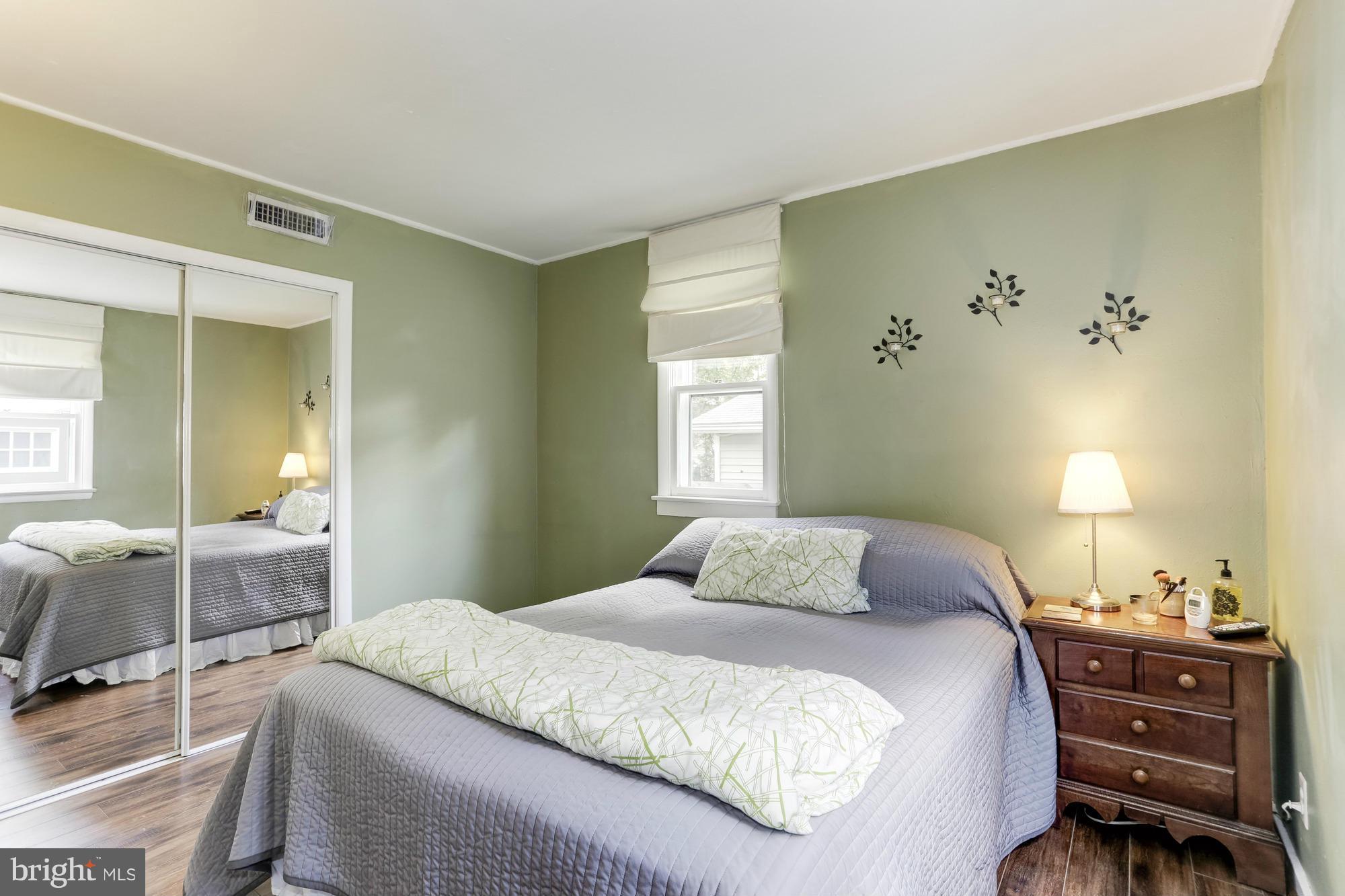 23 Ericsson Road Cabin John, MD 20818 - Photo 14 of 30 a bedroom with a bed and furniture