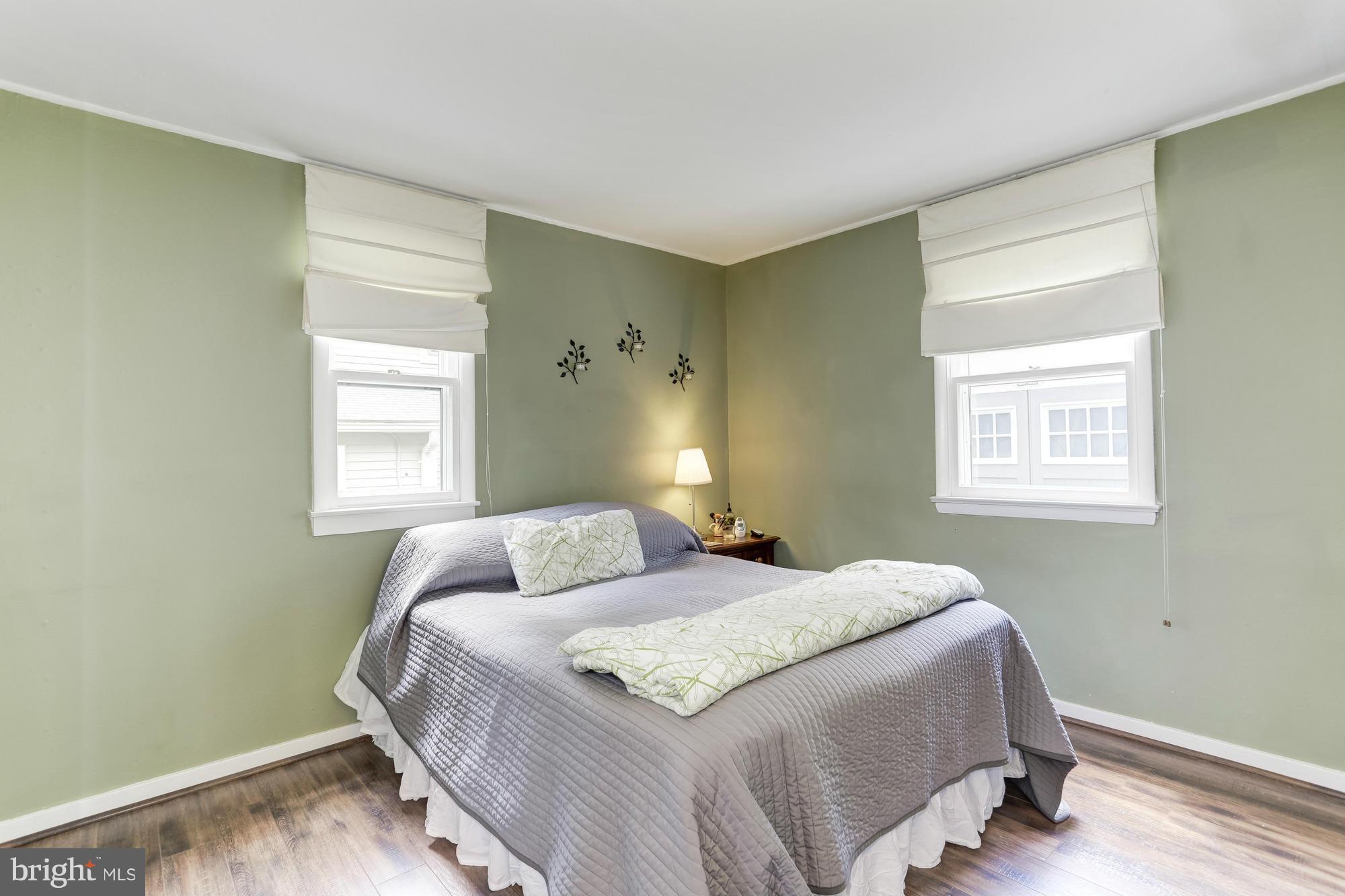 23 Ericsson Road Cabin John, MD 20818 - Photo 15 of 30 a bedroom with a bed and a window