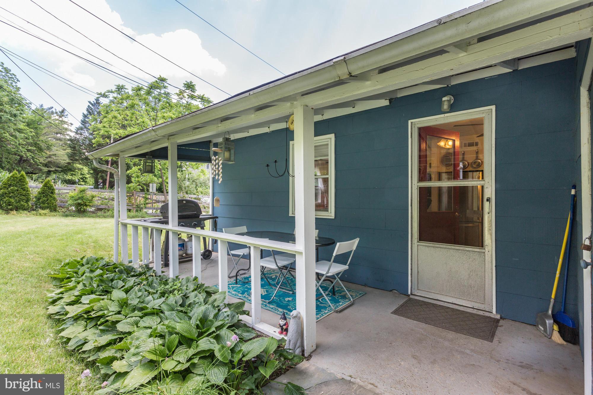 23 Ericsson Road Cabin John, MD 20818 - Photo 3 of 30 a front view of a house with a porch