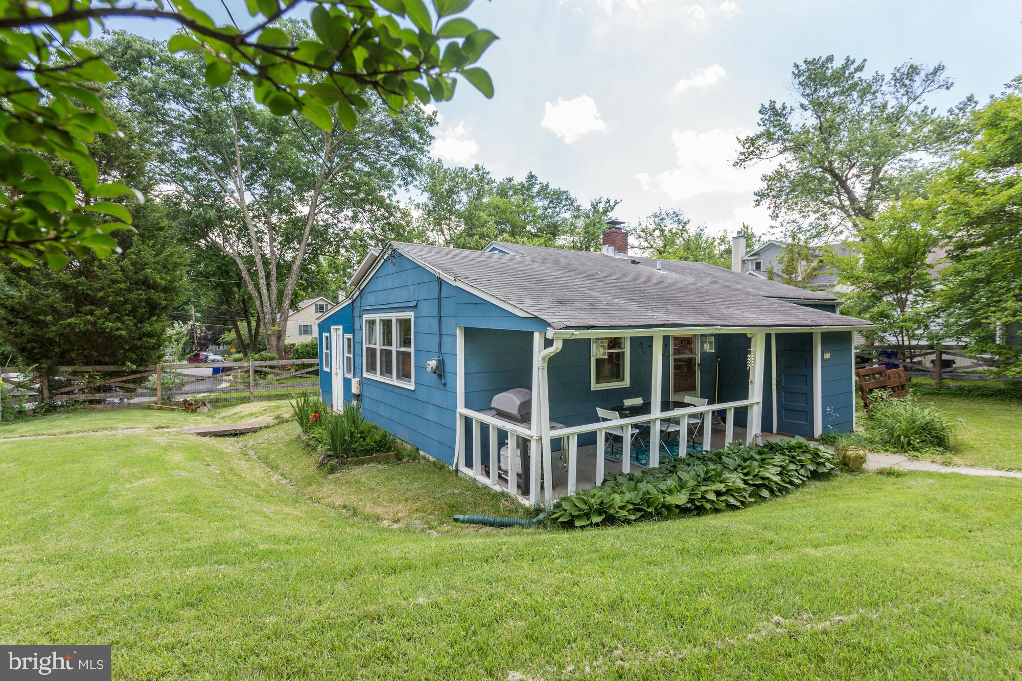 23 Ericsson Road Cabin John, MD 20818 - Photo 22 of 30 a view of a house with a big yard plants and large trees