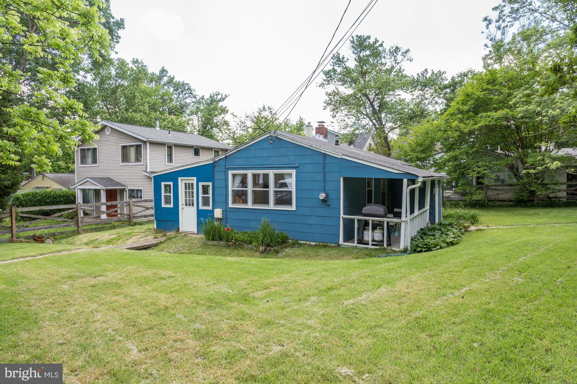 23 Ericsson Road Cabin John, MD 20818 - Photo 23 of 30 a view of a house with a yard and sitting area