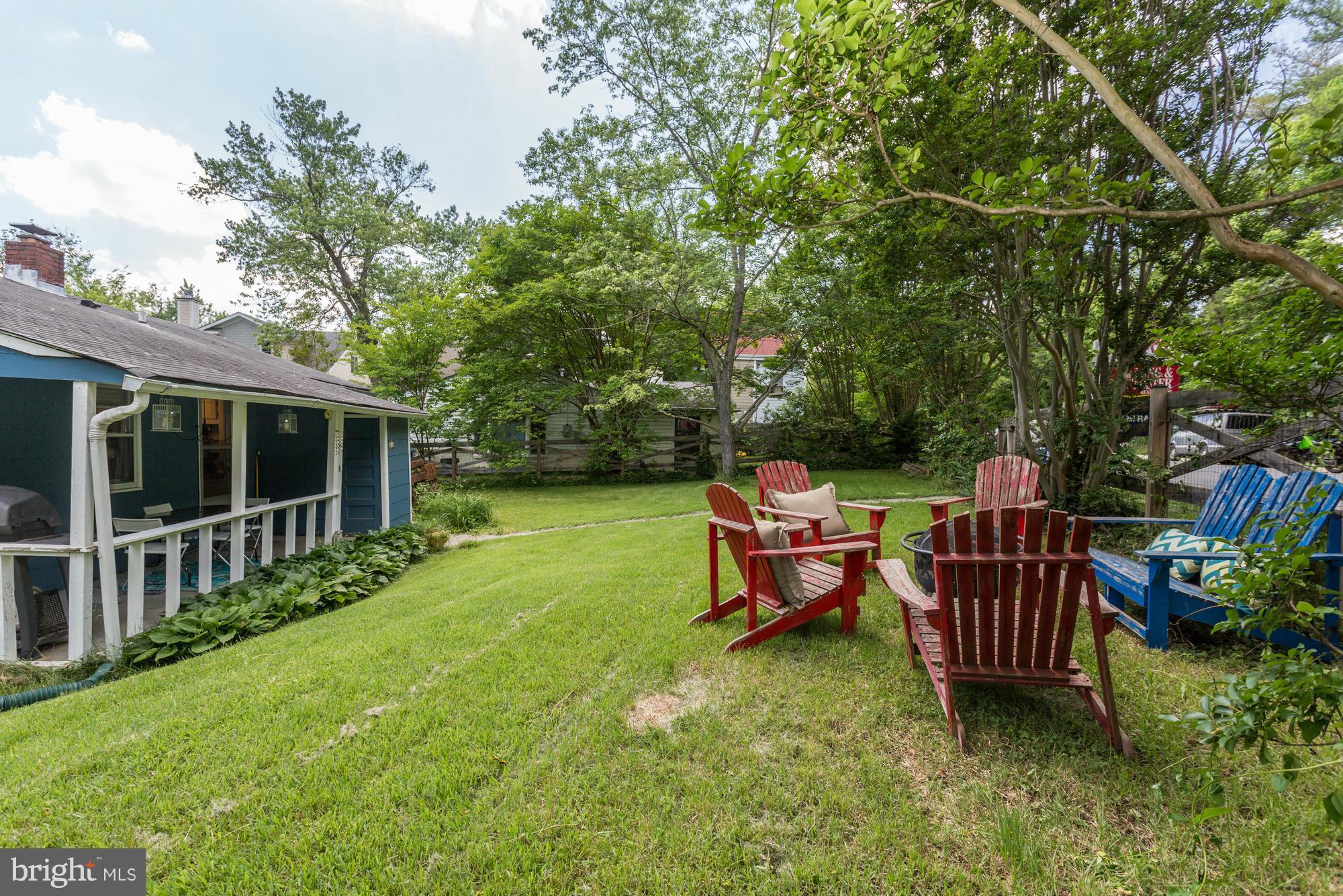 23 Ericsson Road Cabin John, MD 20818 - Photo 25 of 30 a view of a chair and table in the garden