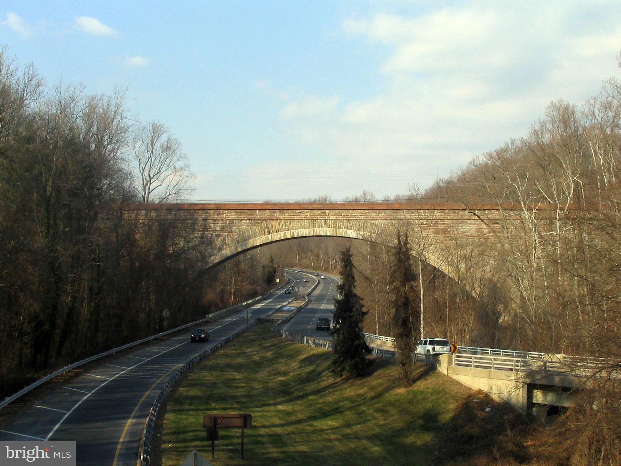 23 Ericsson Road Cabin John, MD 20818 - Photo 27 of 30 a view of a water fountain and a floor to ceiling window