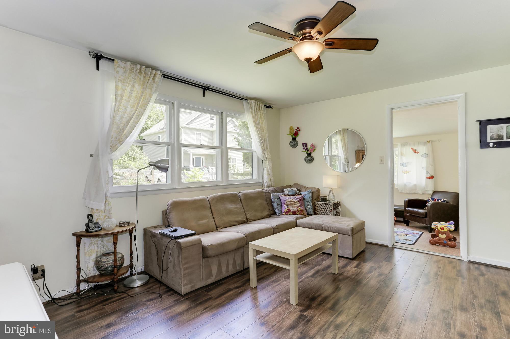 23 Ericsson Road Cabin John, MD 20818 - Photo 6 of 30 a living room with furniture and a large window