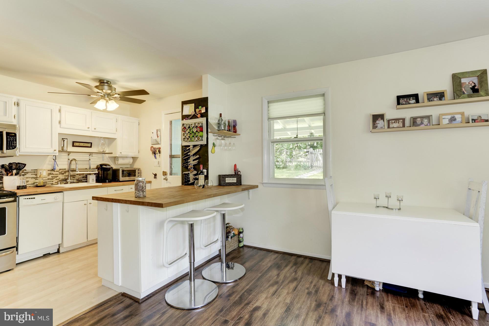23 Ericsson Road Cabin John, MD 20818 - Photo 7 of 30 a kitchen with a sink cabinets and window