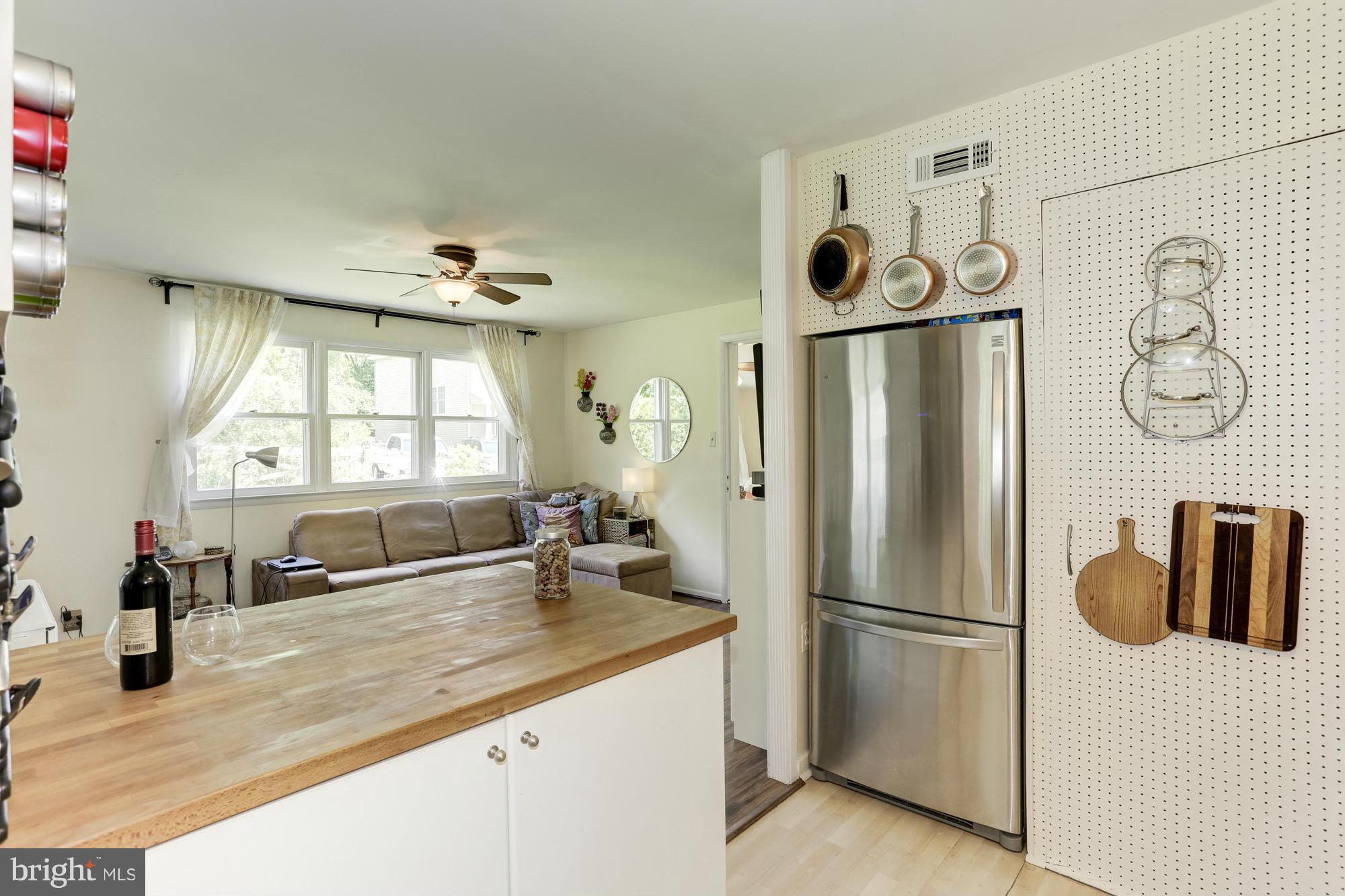 23 Ericsson Road Cabin John, MD 20818 - Photo 10 of 30 a kitchen with refrigerator and window