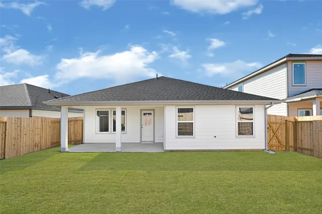 a big house with a big yard and large trees