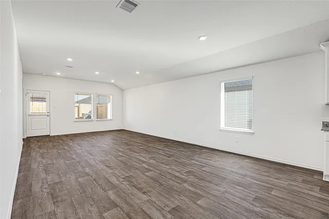 a view of kitchen with refrigerator sink and wooden floor