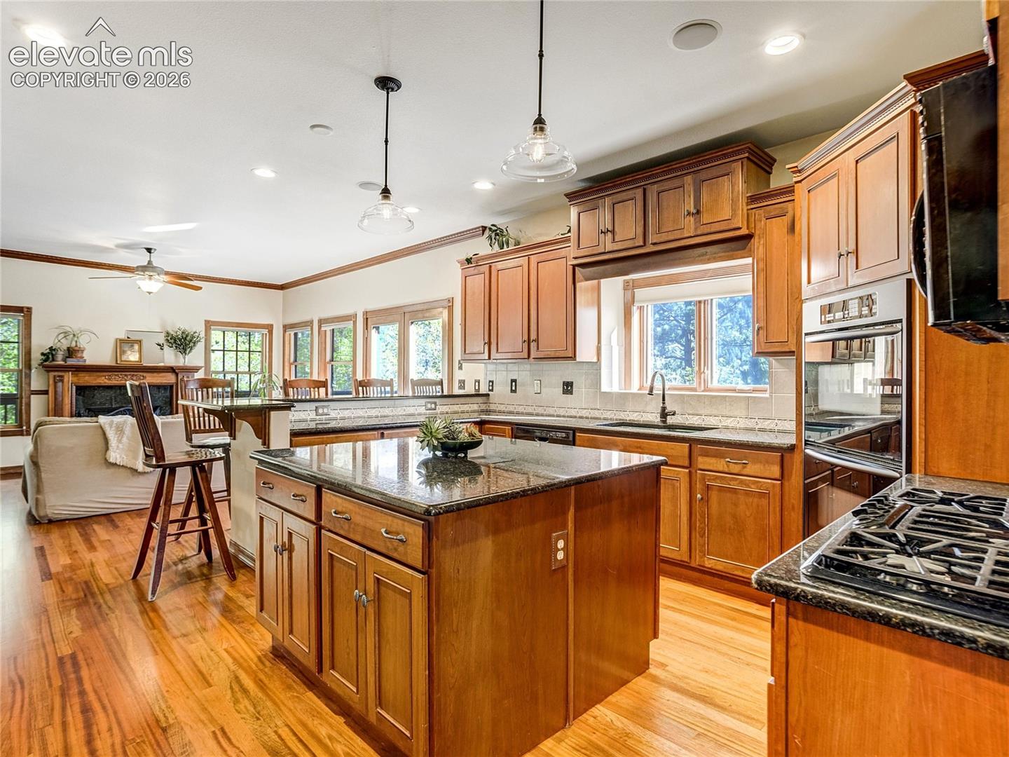 4660 Hagerman Road Cascade, CO 80809 - Photo 5 of 50 The cook’s kitchen is anchored by the large island and includes a gas range and ample counter space.
