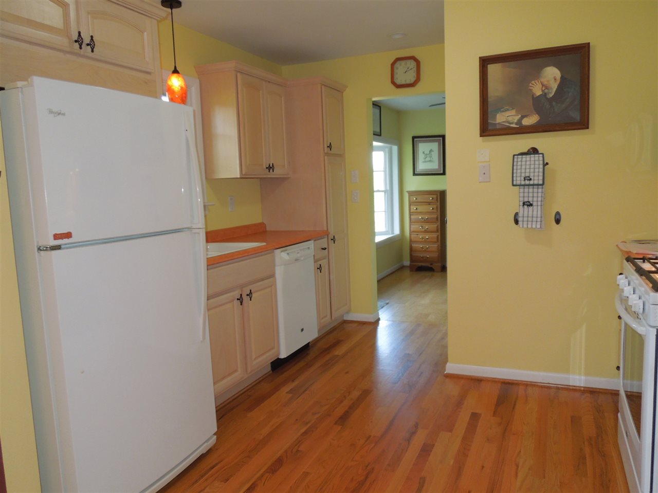 704 Union Church Road Churchville, VA 24421 - Photo 6 of 28 a kitchen with a refrigerator a sink and wooden floor