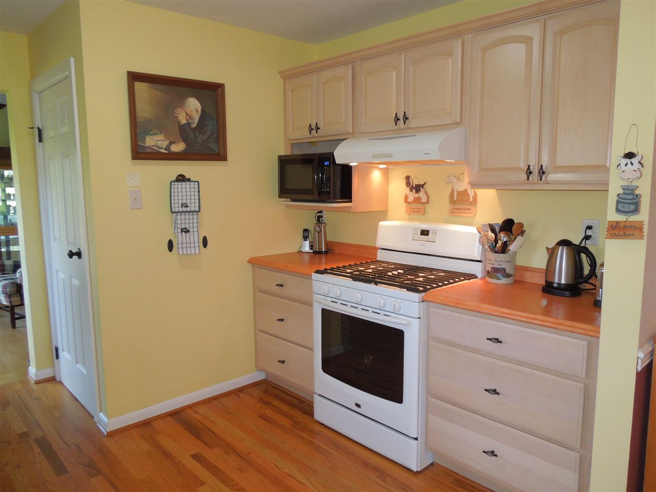 704 Union Church Road Churchville, VA 24421 - Photo 8 of 28 a kitchen with stainless steel appliances white cabinets and a stove top oven
