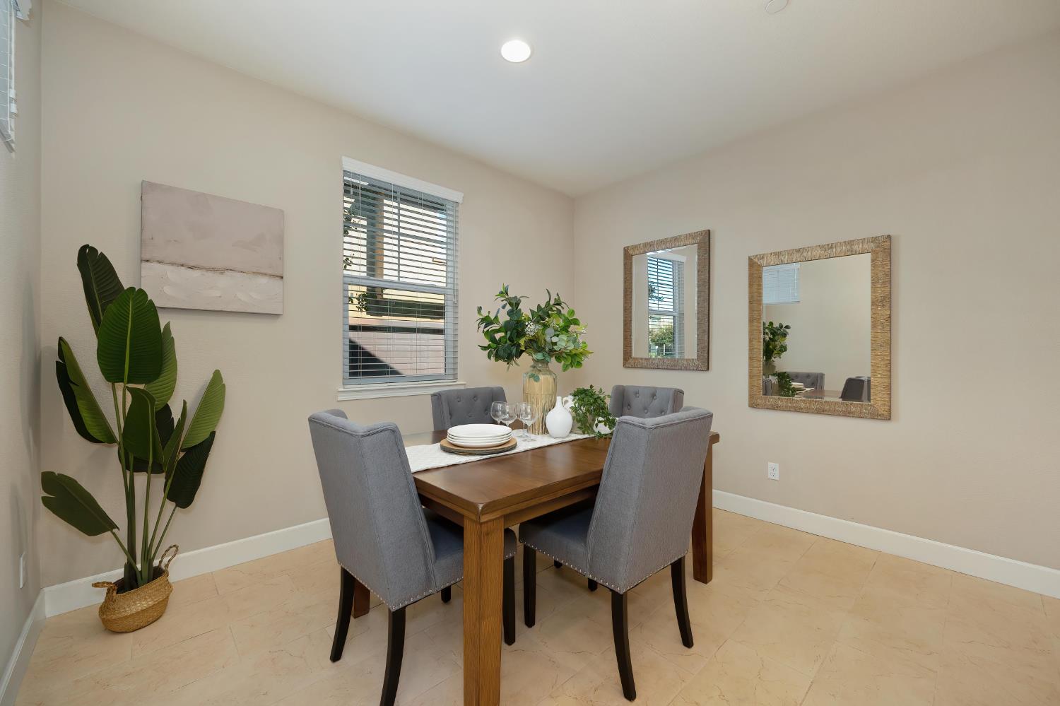 908 Lyon Place Roseville, CA 95747 - Photo 19 of 32 a dining room with furniture and a potted plant