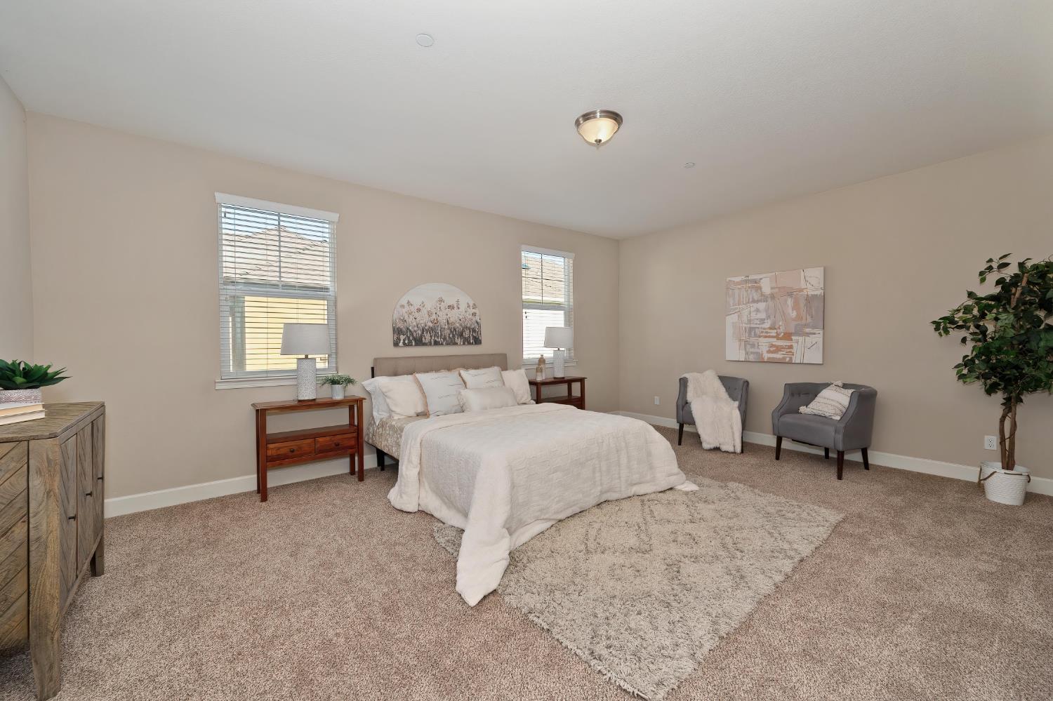 908 Lyon Place Roseville, CA 95747 - Photo 22 of 32 a bed room with a bed and a chair