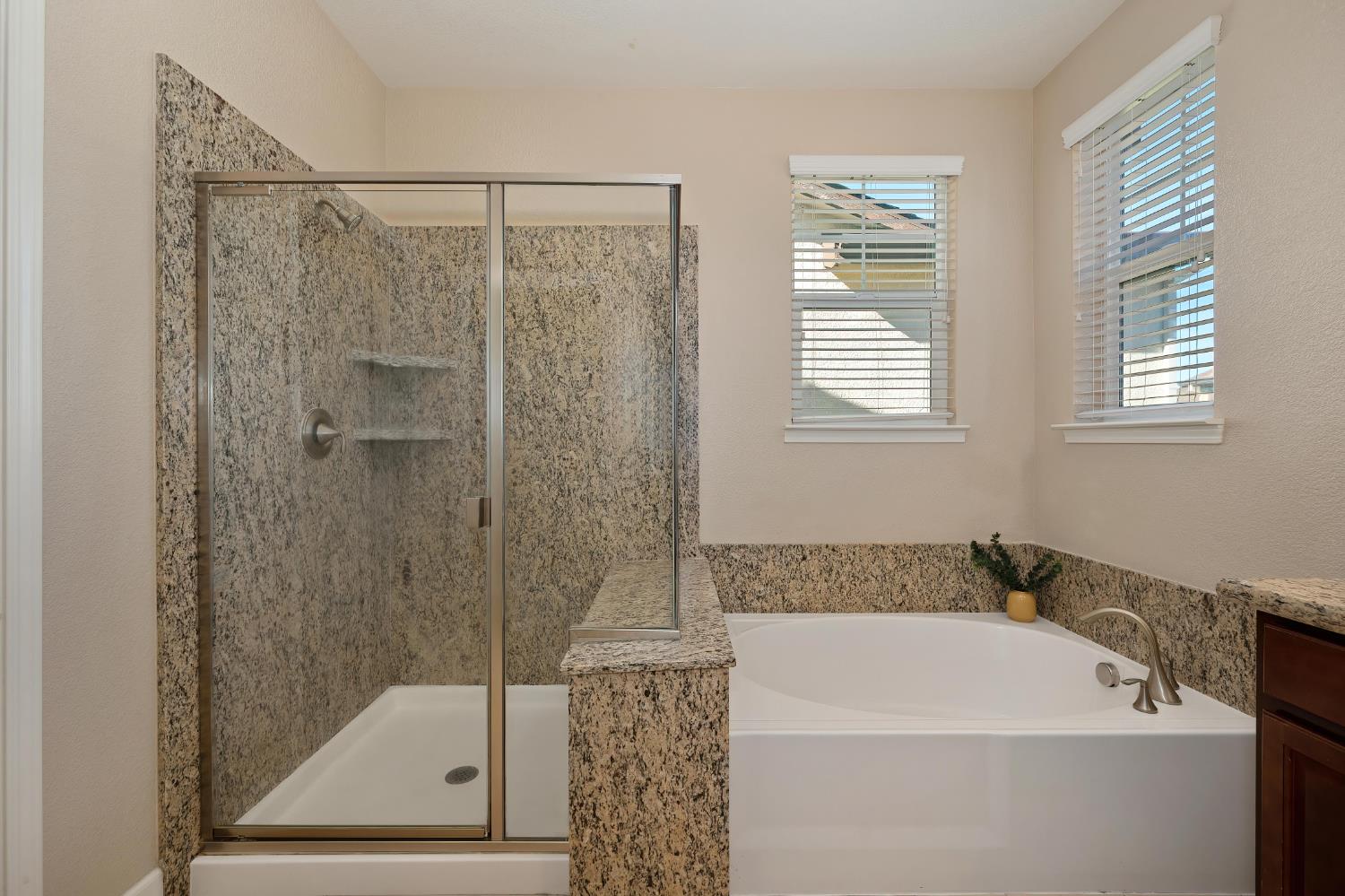 908 Lyon Place Roseville, CA 95747 - Photo 26 of 32 a bathroom with a shower a window and a shower