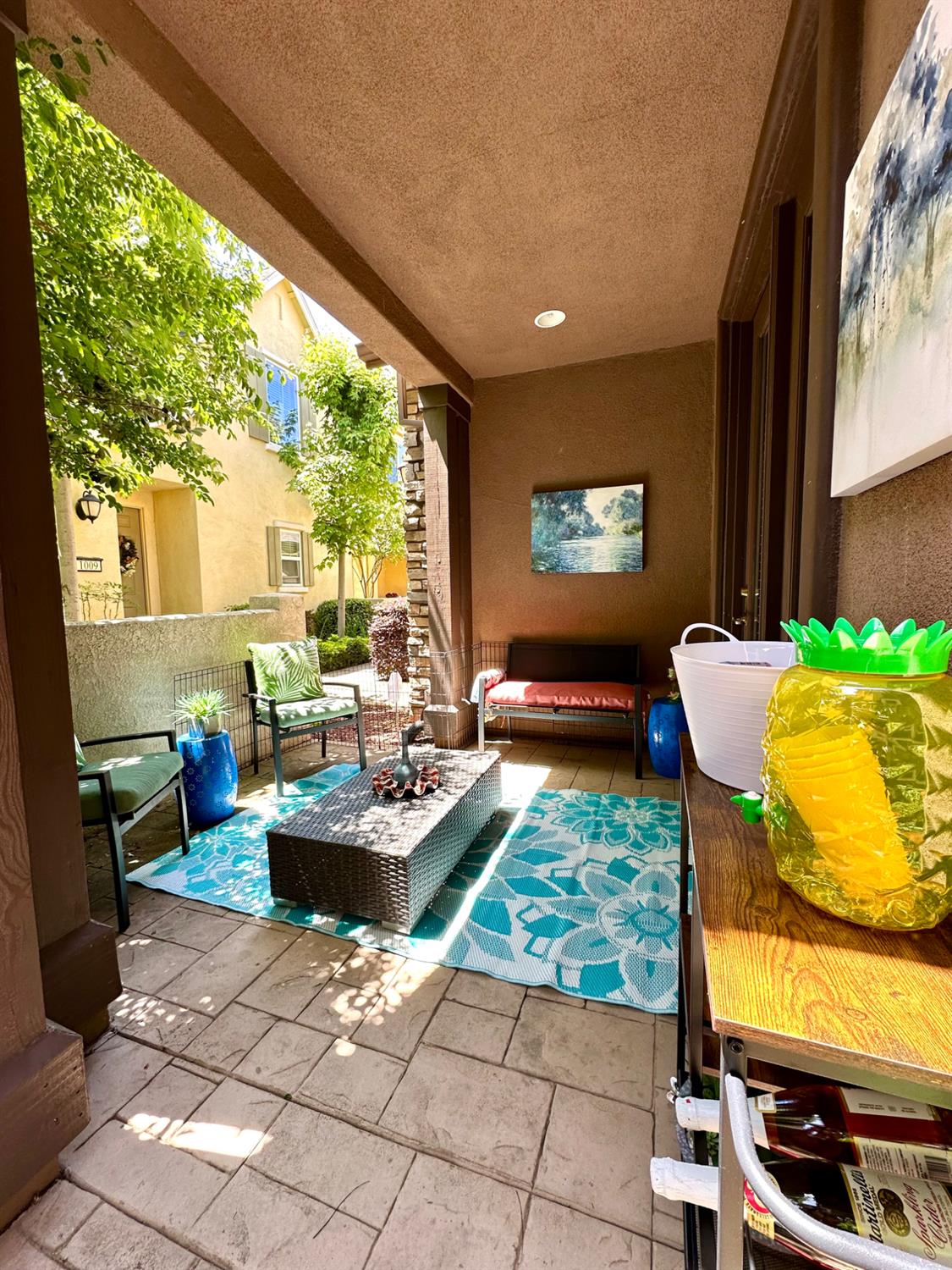 908 Lyon Place Roseville, CA 95747 - Photo 3 of 32 a living room with patio furniture and a floor to ceiling window