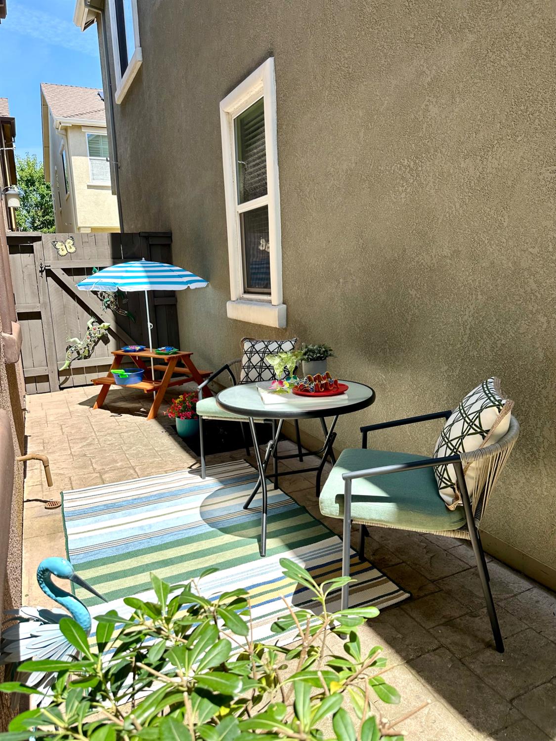 908 Lyon Place Roseville, CA 95747 - Photo 8 of 32 Side patio, just off the covered portion, with room for adults to oversee kids play.