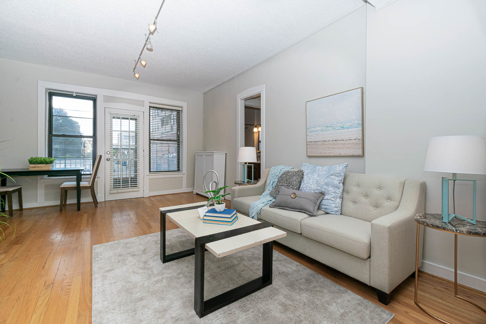 725 West Sheridan Road, Unit 206 Chicago, IL 60613 - Photo 3 of 13 a living room with furniture and wooden floor