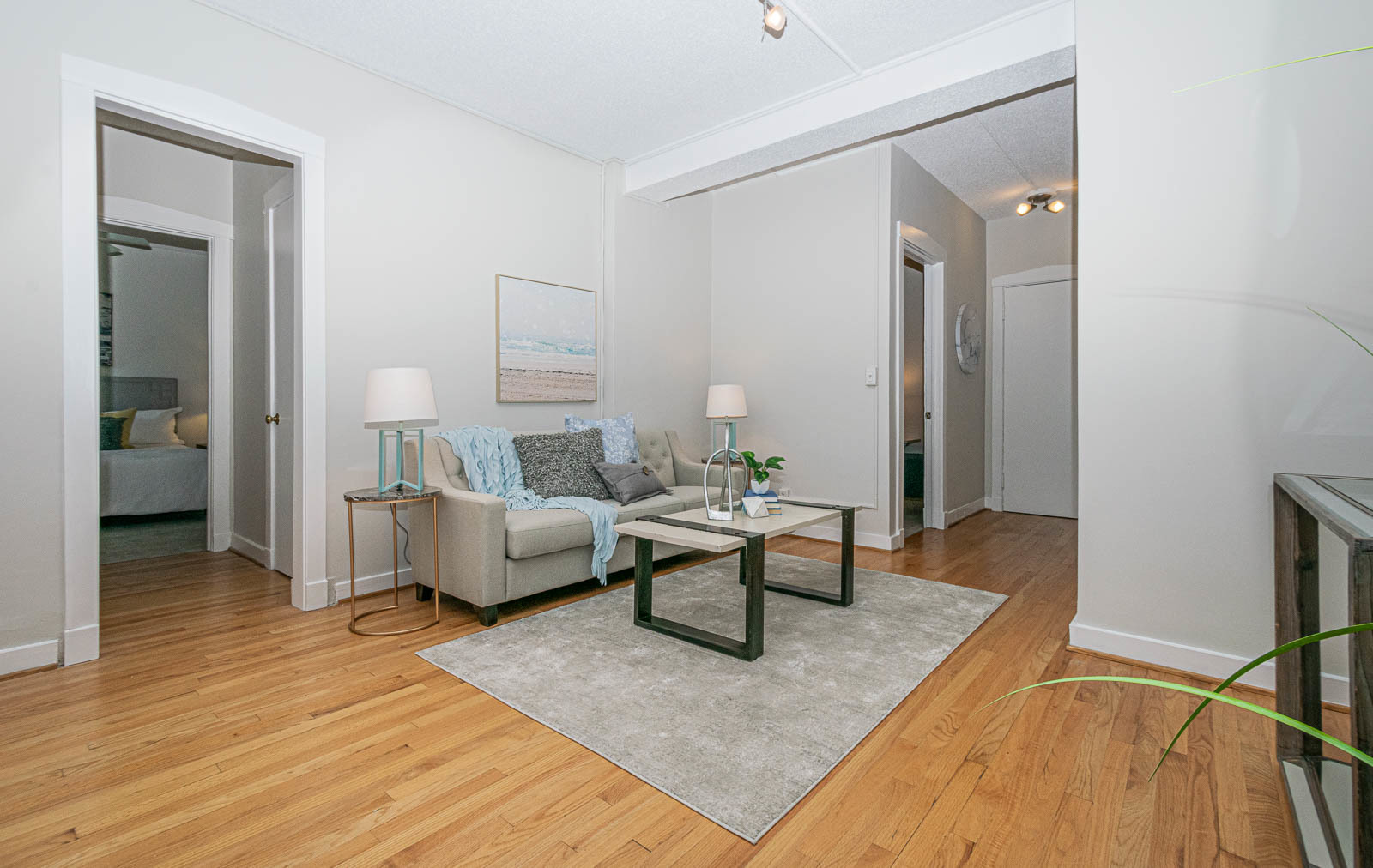 725 West Sheridan Road, Unit 206 Chicago, IL 60613 - Photo 5 of 13 a living room with furniture and a wooden floor