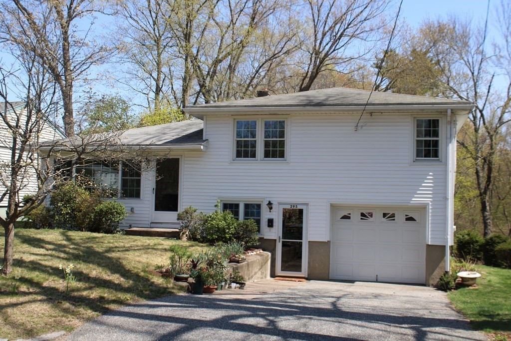 295 Draper Street Springfield, MA 01108 - Photo 1 of 31 a view of a house with a yard and tree s