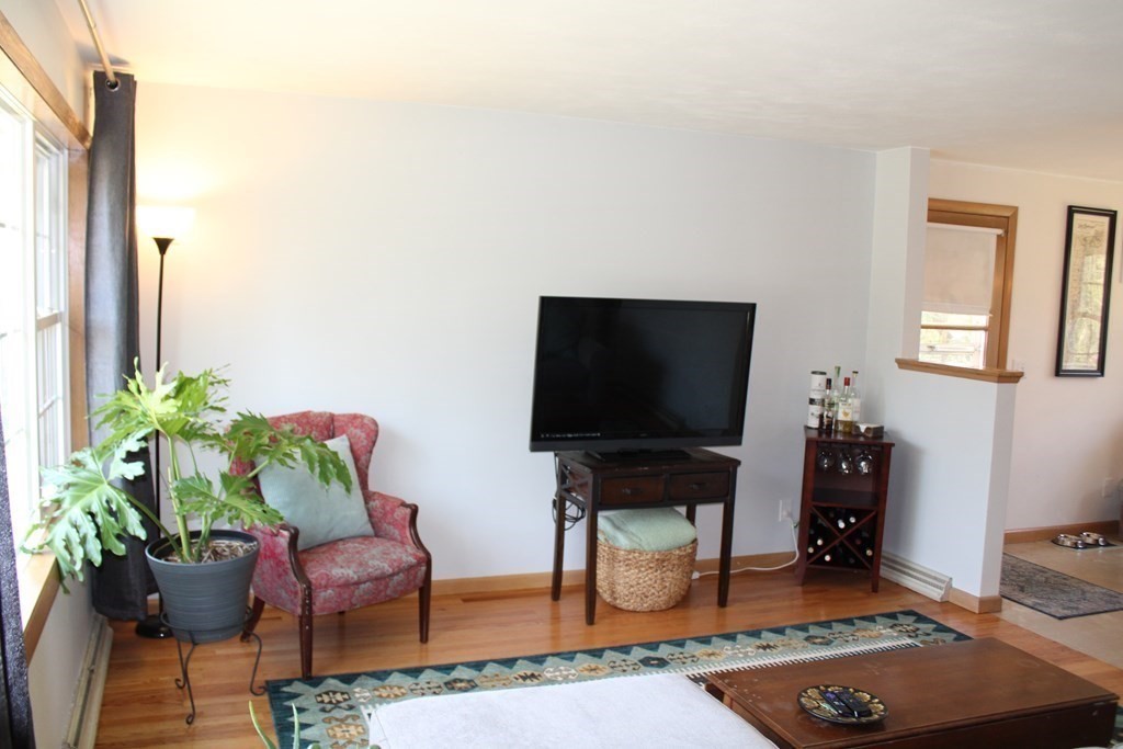 295 Draper Street Springfield, MA 01108 - Photo 12 of 31 a living room with furniture and a flat screen tv