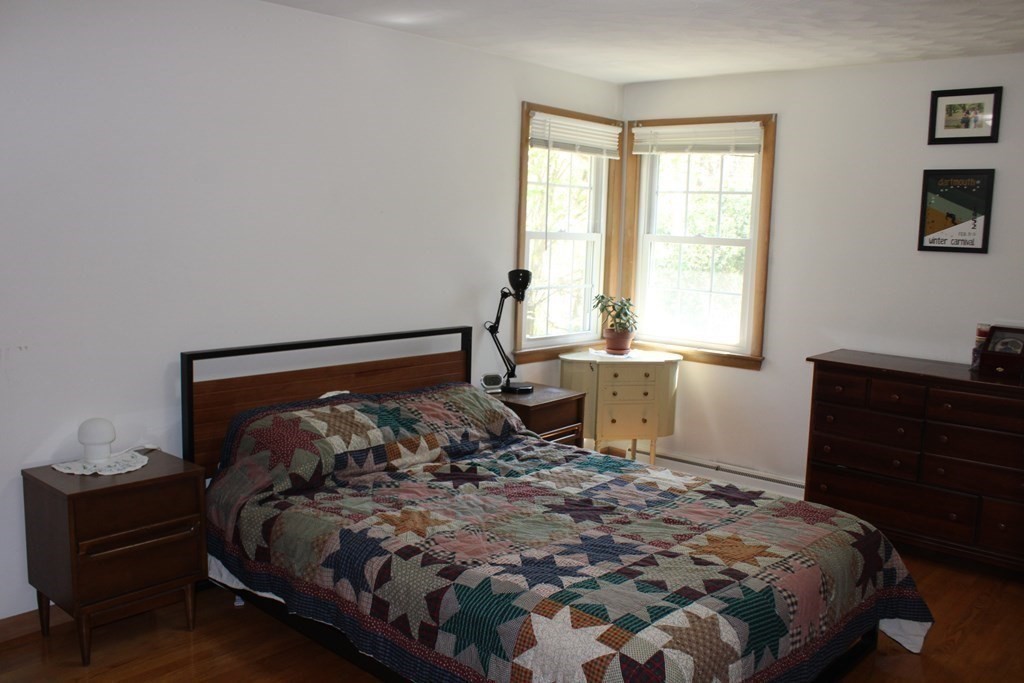295 Draper Street Springfield, MA 01108 - Photo 21 of 31 a bed sitting in a bedroom next to a window
