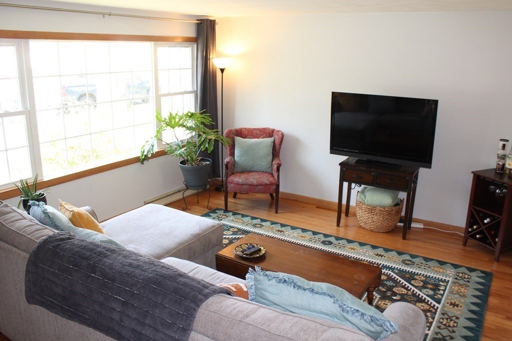 295 Draper Street Springfield, MA 01108 - Photo 8 of 31 a living room with furniture and a flat screen tv