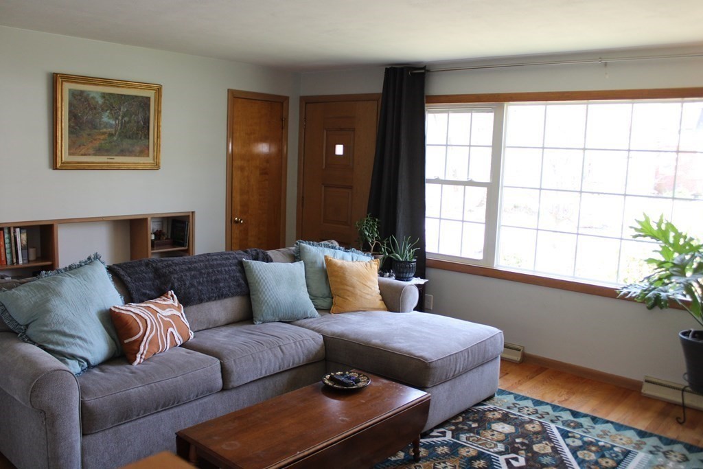 295 Draper Street Springfield, MA 01108 - Photo 9 of 31 a living room with furniture and a window