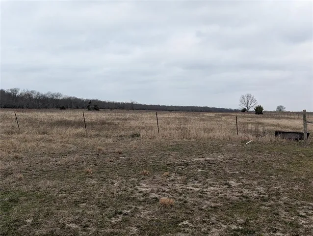 a view of an ocean beach and mountain