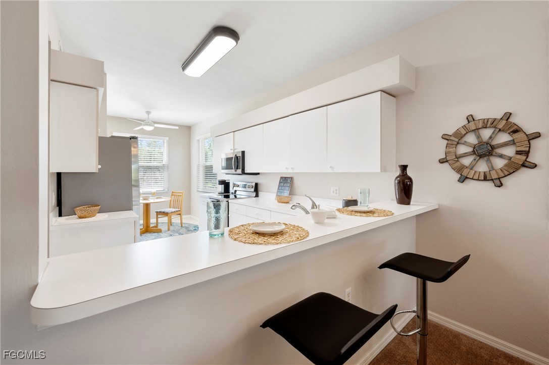 14091 Brant Point Circle, Unit 4201 Fort Myers, FL 33919 - Photo 11 of 23 a bathroom with a sink and a mirror