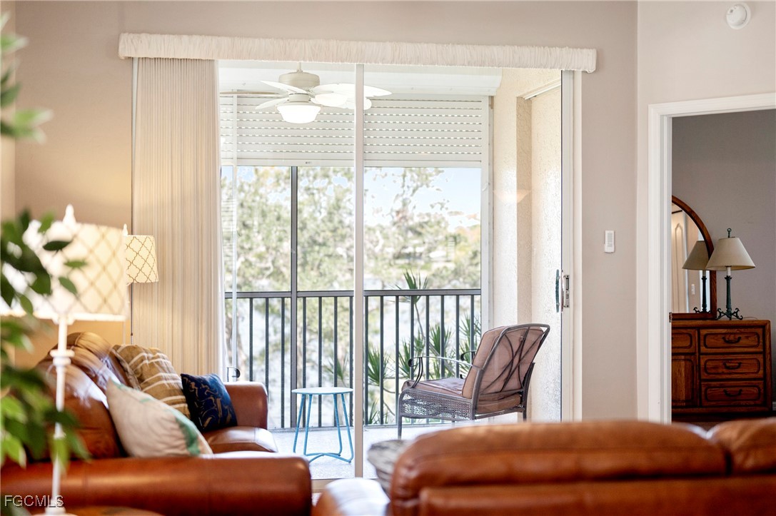 14091 Brant Point Circle, Unit 4201 Fort Myers, FL 33919 - Photo 18 of 23 a living room with furniture and a large window