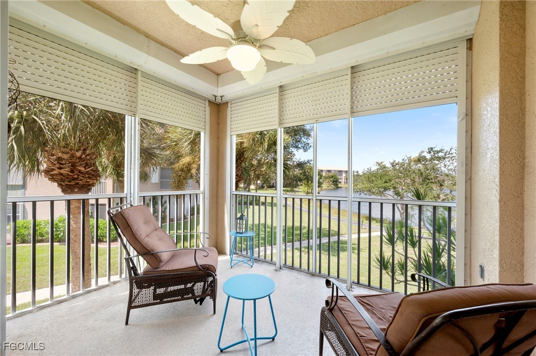 14091 Brant Point Circle, Unit 4201 Fort Myers, FL 33919 - Photo 22 of 23 a balcony with furniture and large windows