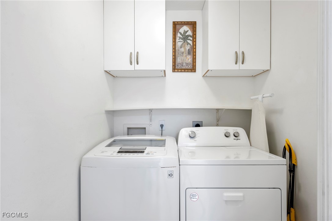 14091 Brant Point Circle, Unit 4201 Fort Myers, FL 33919 - Photo 23 of 23 a utility room with dryer and washer