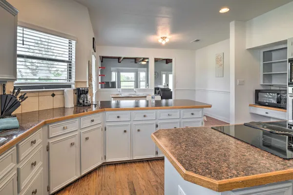 a kitchen with stainless steel appliances granite countertop a sink stove and cabinets