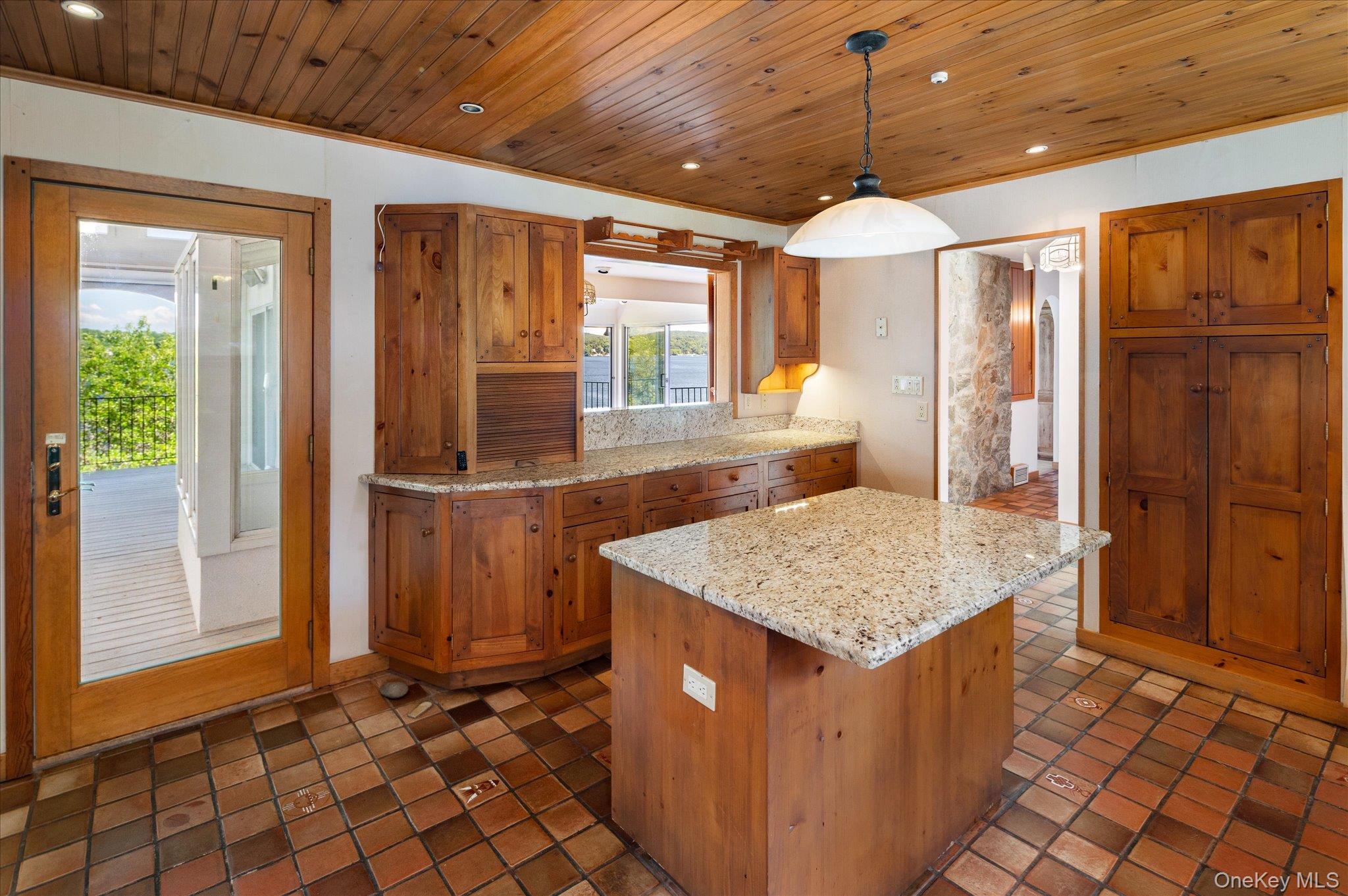 41 Tamarack Road Mahopac, NY 10541 - Photo 25 of 41 Custom cabinetry, granite countertops, and a farmhouse sink in this Lake Mahopac waterfront home