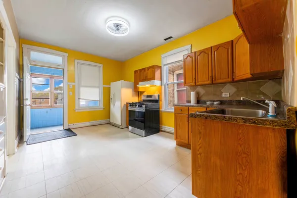 a view of a kitchen with a sink