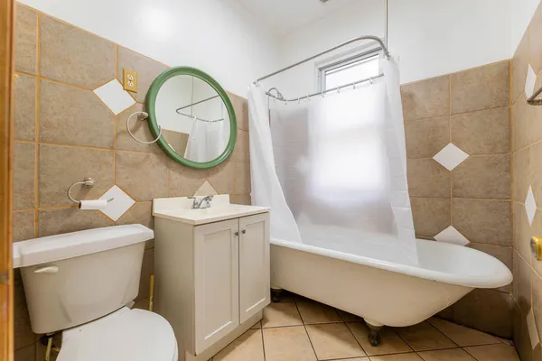 a bathroom with a sink a mirror and a toilet