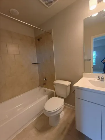 a bathroom with a sink a toilet and a bathtub