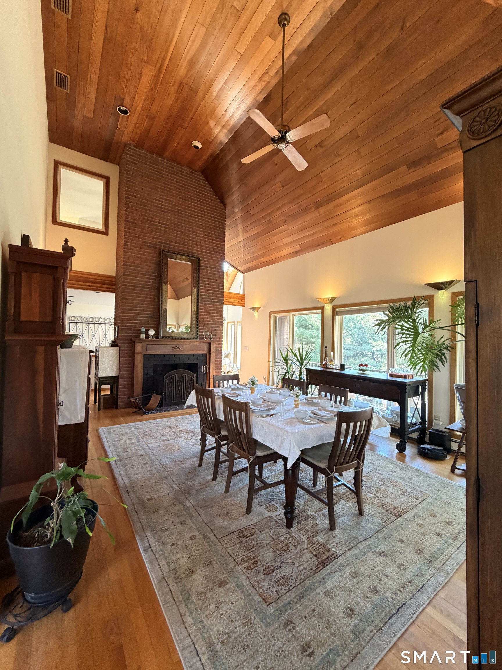 86 Washburn Road Canton, CT 06019 - Photo 3 of 40 a dining room with furniture and a floor to ceiling window