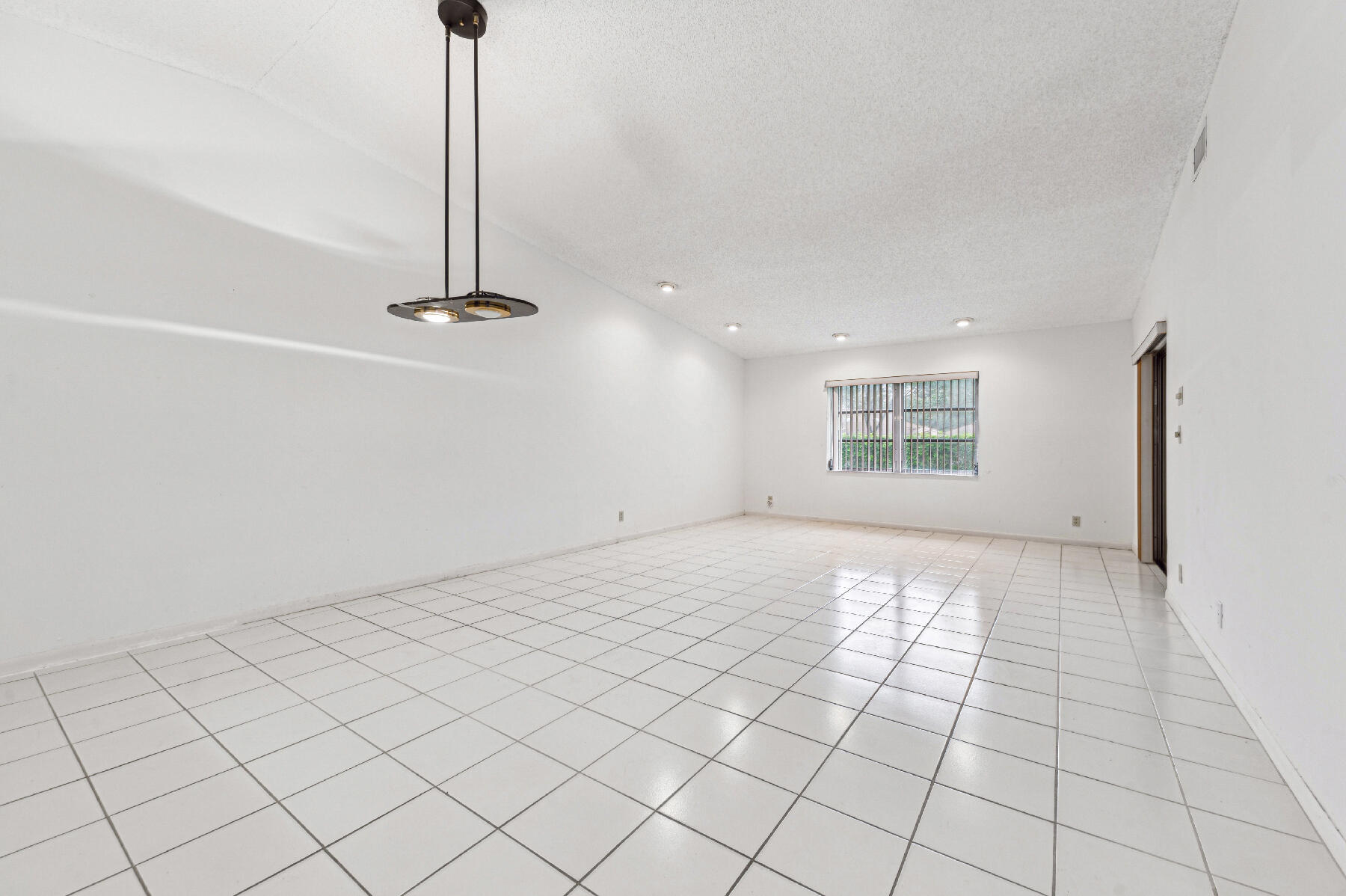 8191 Sweetbriar Way Boca Raton, FL 33496 - Photo 2 of 10 a view of an empty room and window