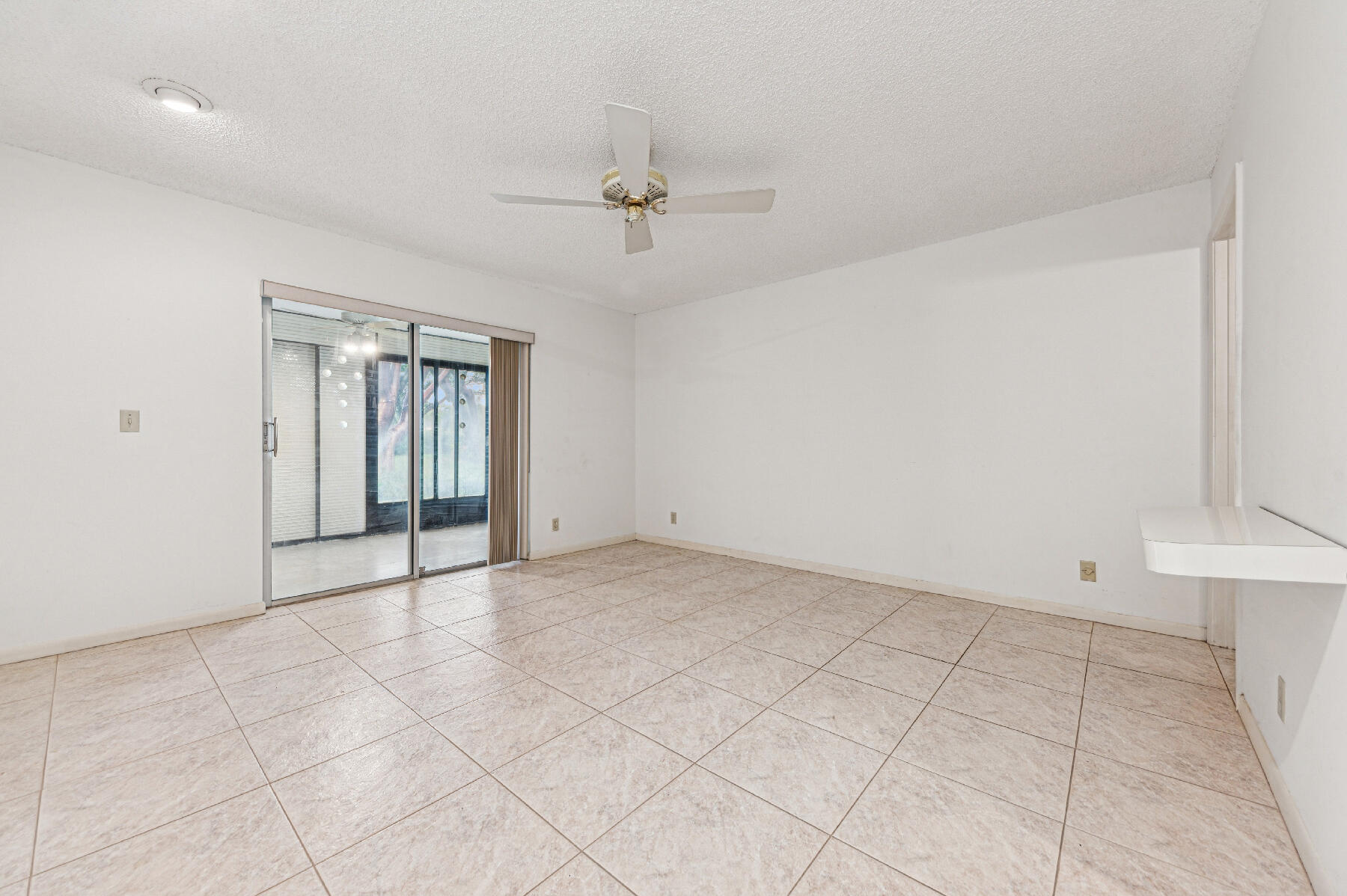 8191 Sweetbriar Way Boca Raton, FL 33496 - Photo 5 of 10 a view of an empty room with a window