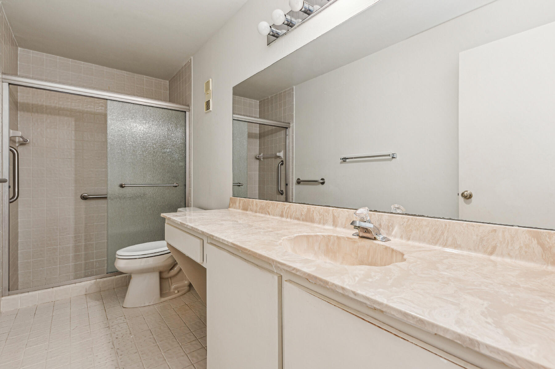 8191 Sweetbriar Way Boca Raton, FL 33496 - Photo 6 of 10 a bathroom with a sink a toilet and shower