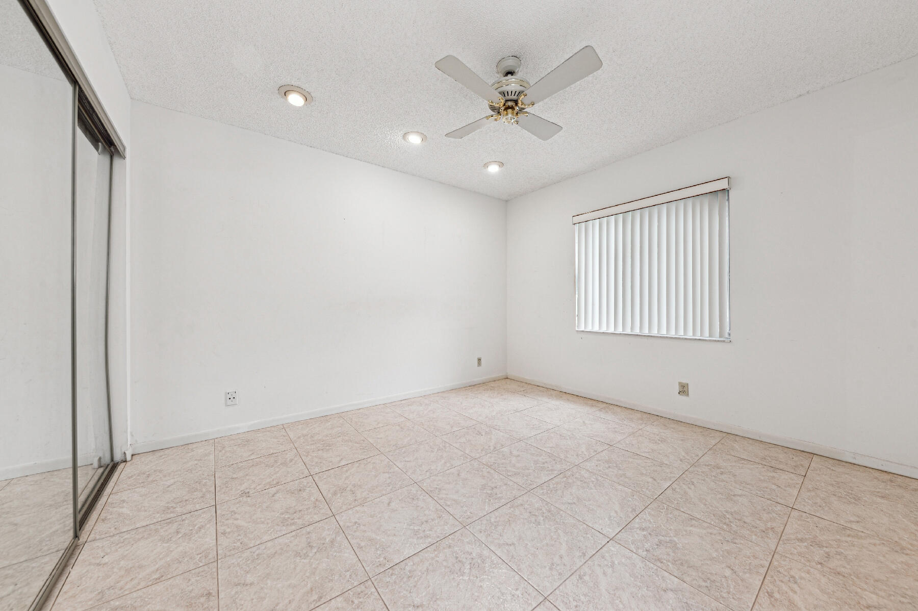 8191 Sweetbriar Way Boca Raton, FL 33496 - Photo 7 of 10 a view of an empty room with a window